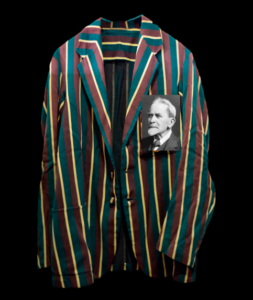 Image of a school blazer with the image of Sir James Frazer superimposed over the school badge