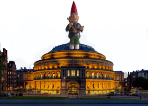 with reference to internet memes with the phrase 'you've heard of Elf on the Shelf, now get ready for...' and the phrase is followed by a composite image of 2 things that also rhyme; here, the picture shows a Gnome on a Dome, with a garden gnome in a red pointed cap superimposed on a photo of the dome of the Albert Hall in London